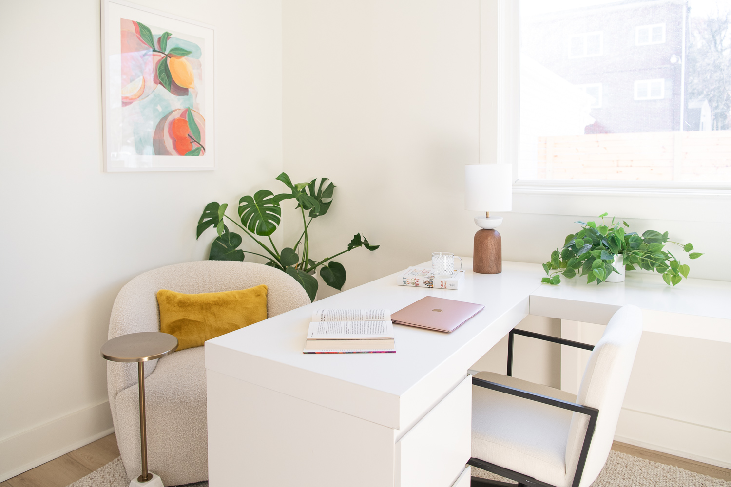 white desk and chairs with plants