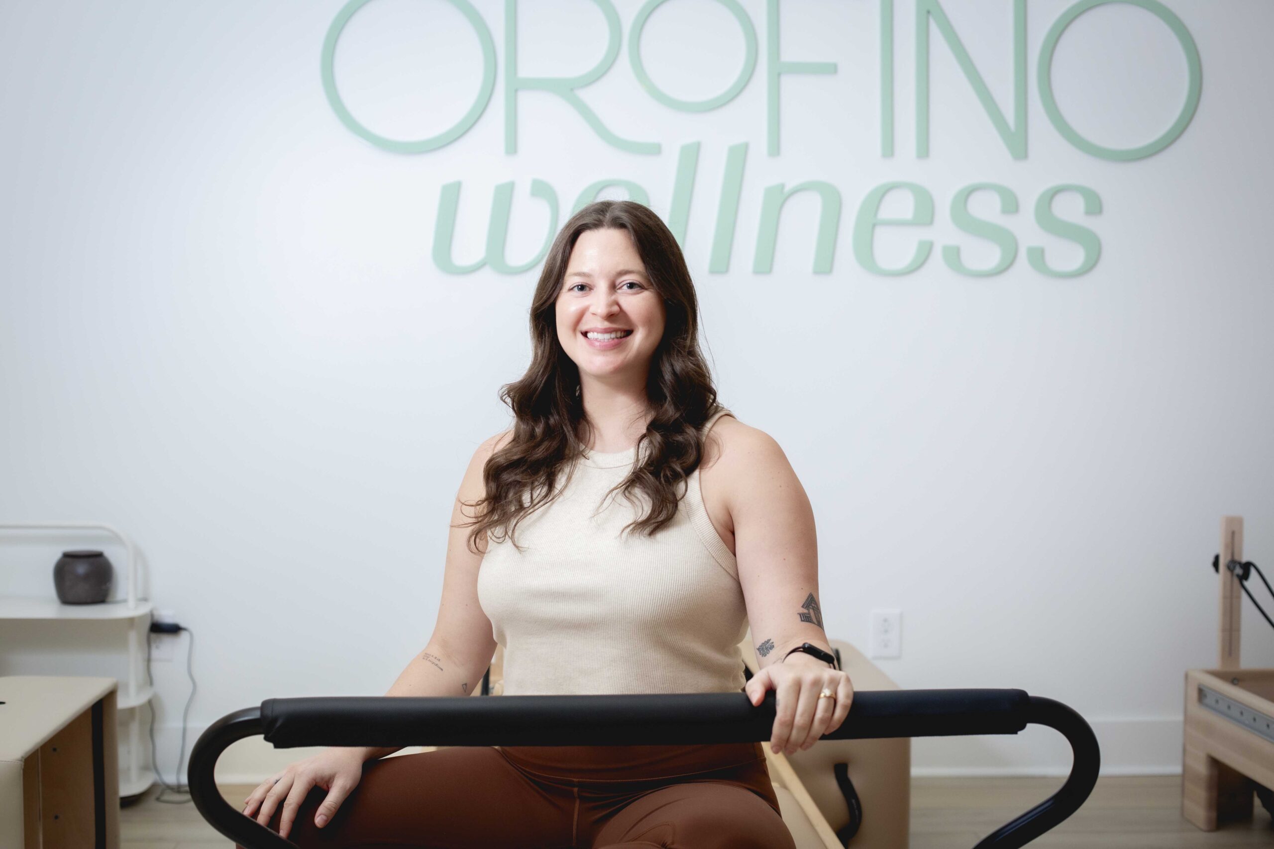 Becca Bennick in front of Orofino Wellness sign