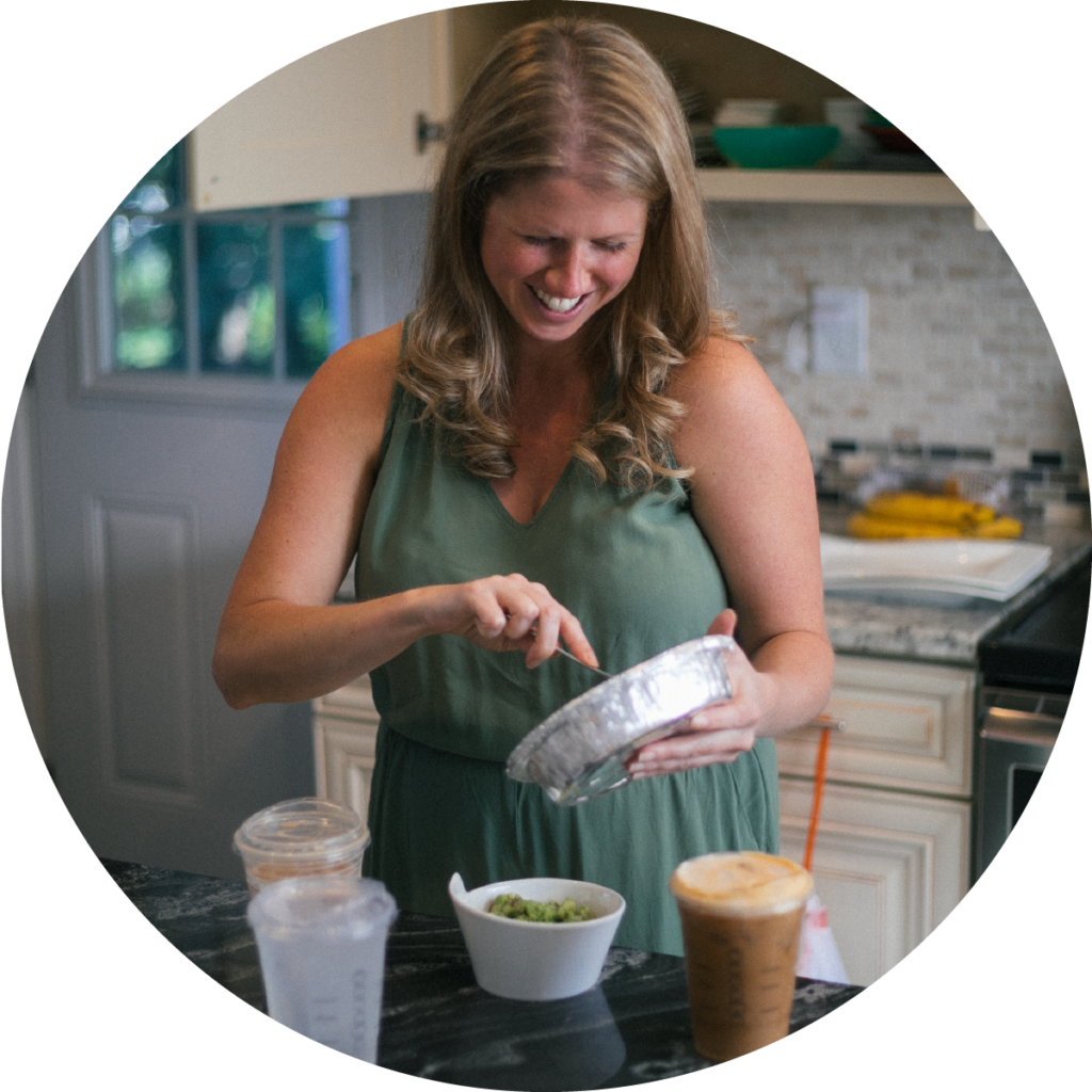 woman happily mixing food in kitchen