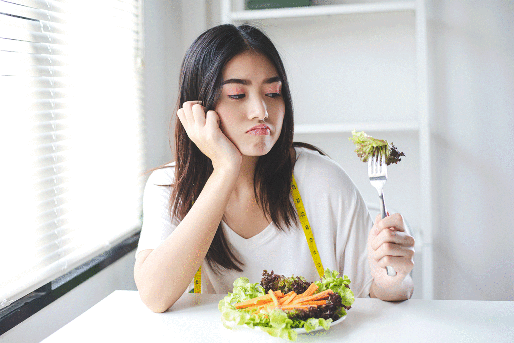 Woman doesn't want to keep eating her salad